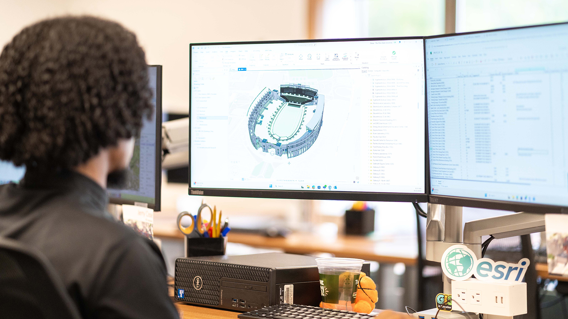 A staff member views Ohio Stadium using Building Information Modeling (BIM).