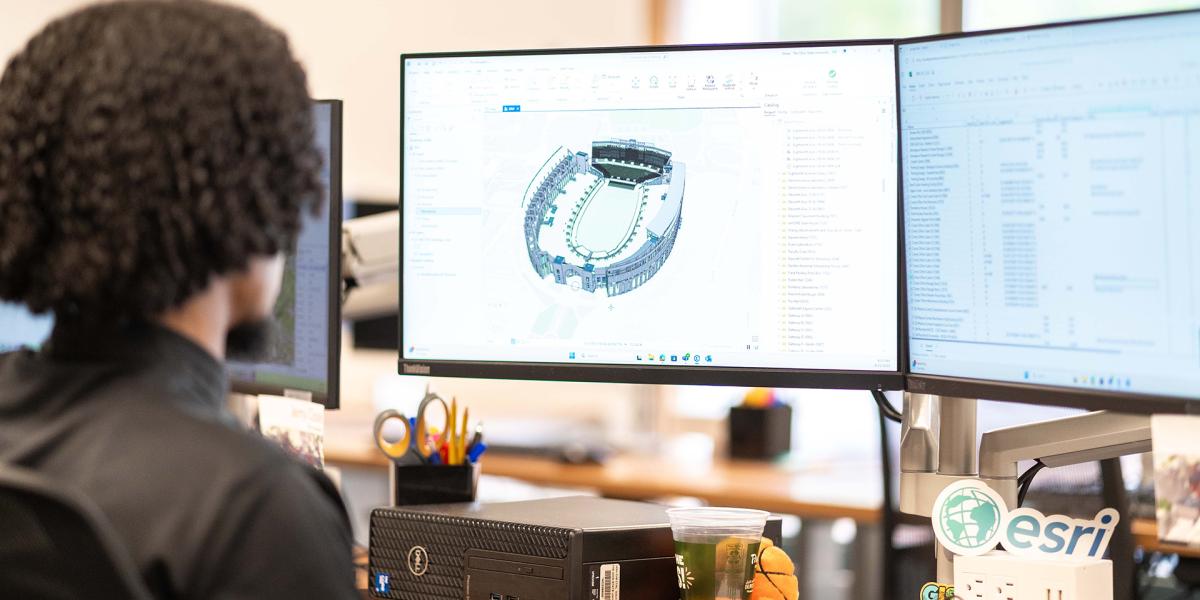 A staff member views Ohio Stadium using Building Information Modeling (BIM).