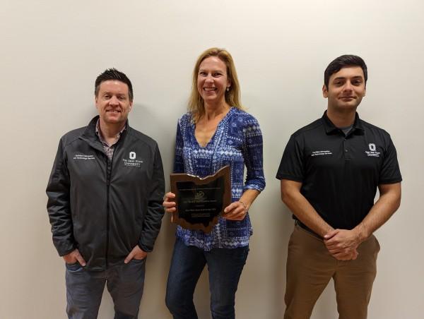 Photo of GIS team and award