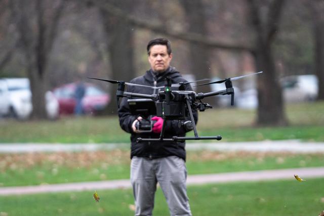 man flying drone